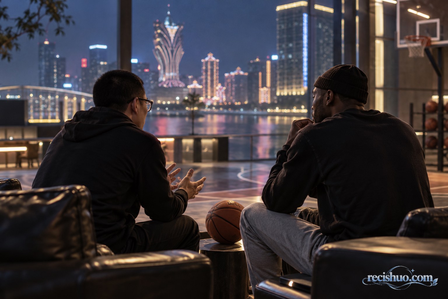 澳门夜景映衬下,两名篮球话题参与者在室内平静交谈